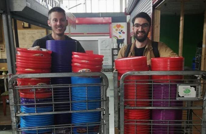 Liam and Arthur behind a wall of sweet tubs