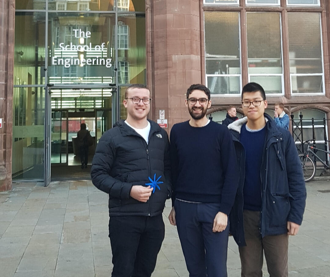 Arthur and two students outside the School of Engineering